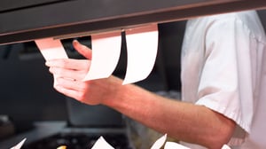 Restaurant chef with order tickets